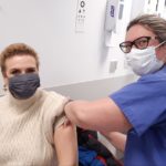 Kathryn Walsh receives vaccination from Dr Lorna McCune at Altrincham Health and Wellbeing Centre